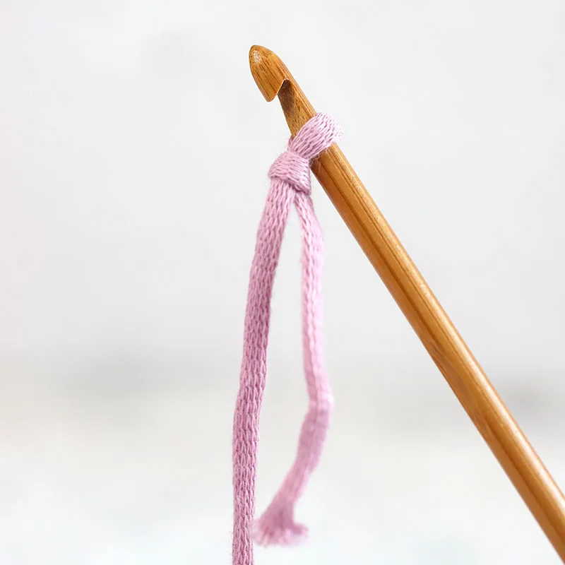 Before you start crocheting, tug the working yarn to tighten the loop around the hook so the yarn fits well on the hook.