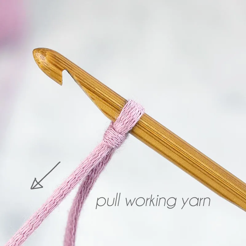 tug on the working yarn to tighten the loop around the hook.