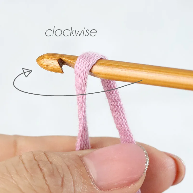 insert the crochet hook through the loop and turn the hook in clockwise rotation