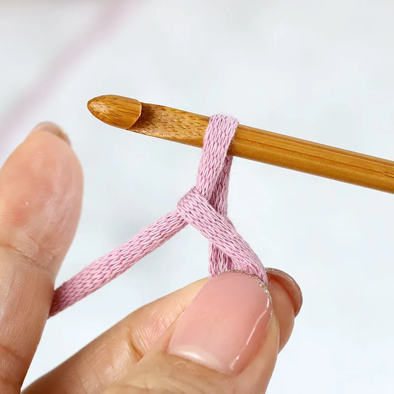 pull to draw the working yarn through the loop