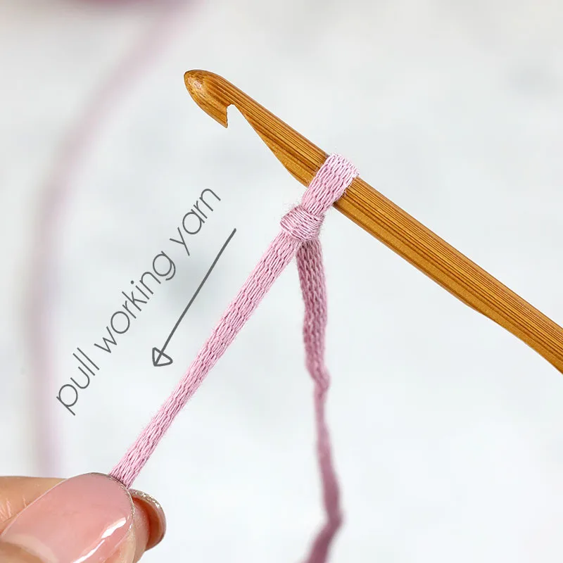 tug on the working yarn to tighten the loop around the hook.