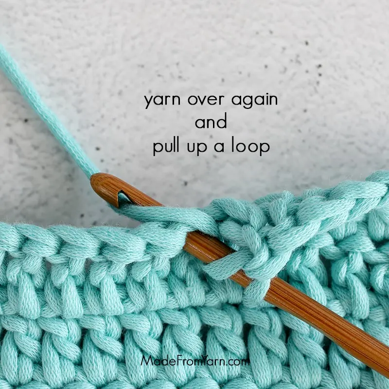 how to crochet dc stitch step 3, yarn over and pull up a loop
