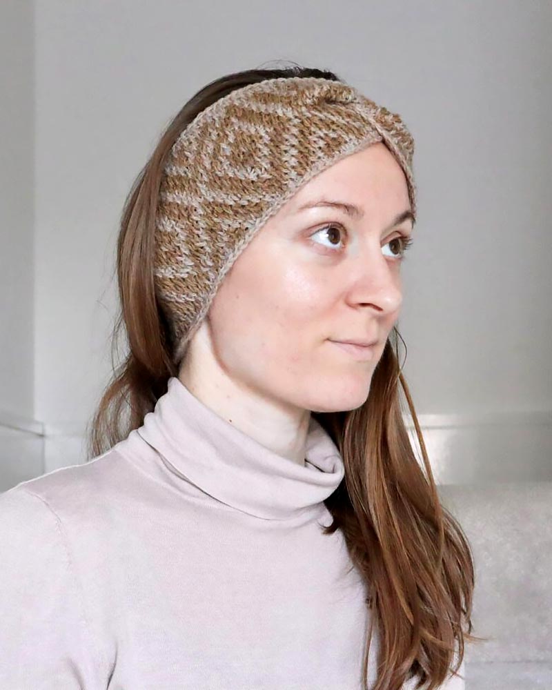 If you’re up for a challenge, try this two-colored Tunisian crochet pattern, crafted using a lightweight yarn that ensures comfort and easy care.