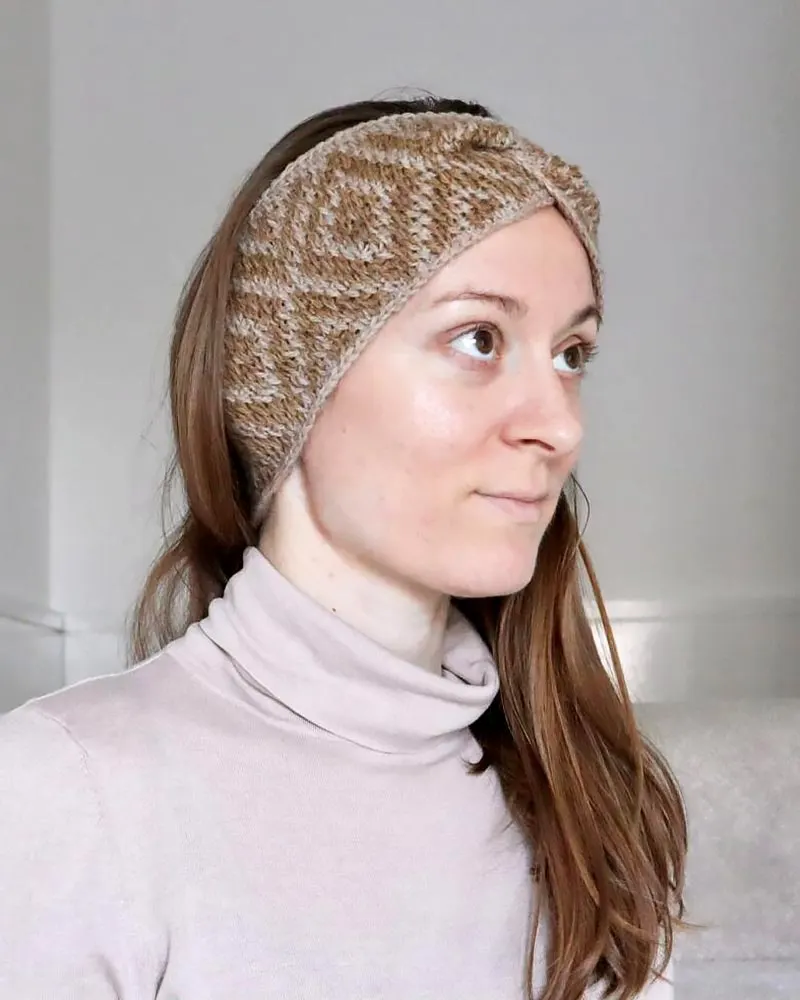 If you’re up for a challenge, try this two-colored Tunisian crochet pattern, crafted using a lightweight yarn that ensures comfort and easy care.