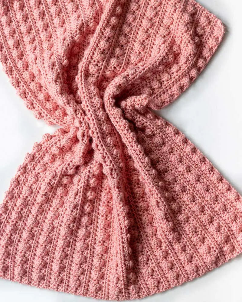 Craft personalized gifts for the little ones with this soft, cozy, textured bobble stitch blanket.