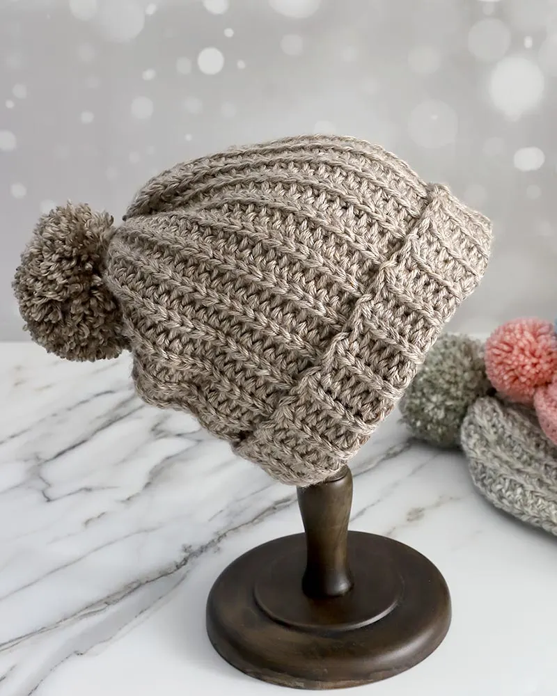 This comprehensive beanie pattern offers sizes ranging from newborn to adult, making it versatile for all ages and skill levels.