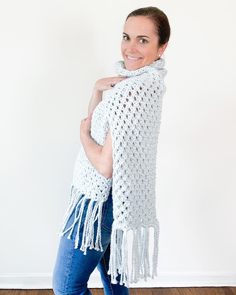 Combine a lace pattern with chunky yarn, and you'll achieve a striking blend of texture and cozy warmth in your project.