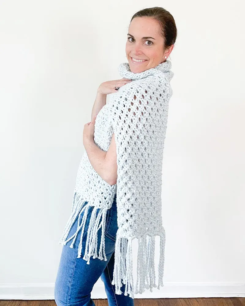 Combine a lace pattern with chunky yarn, and you'll achieve a striking blend of texture and cozy warmth in your project.