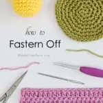 Learn how to fasten off crochet projects in 3 simple steps! This guide also includes tips & instructions on how to finish different types of crochet work.