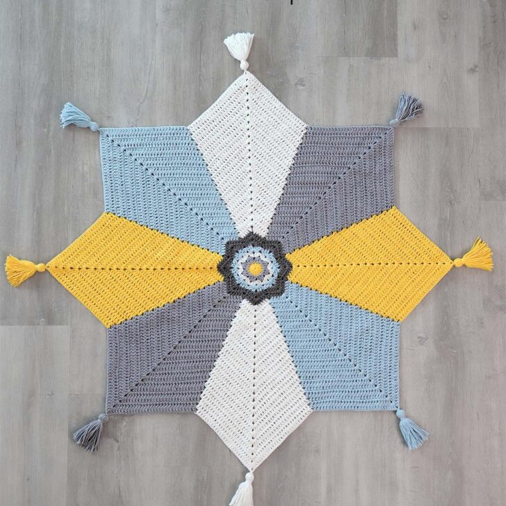 Introducing the Tassel Star Blanket - a beautiful, free crochet pattern of an 8-point star baby blanket, perfect for baby showers & expecting friends.