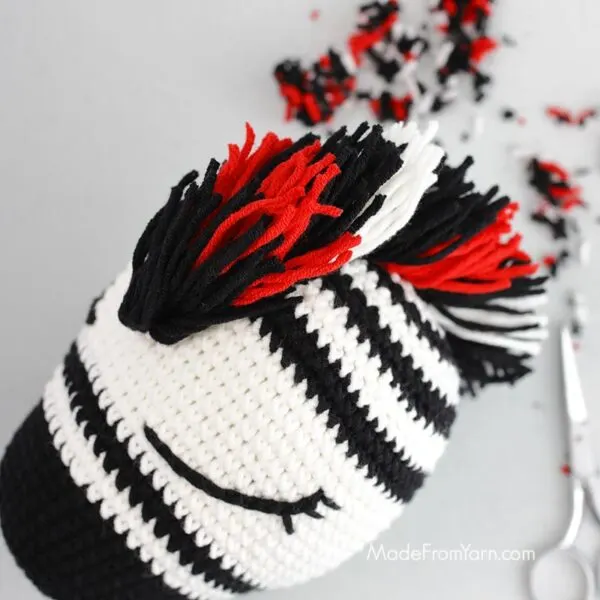 sew crochet mane to zebra's head