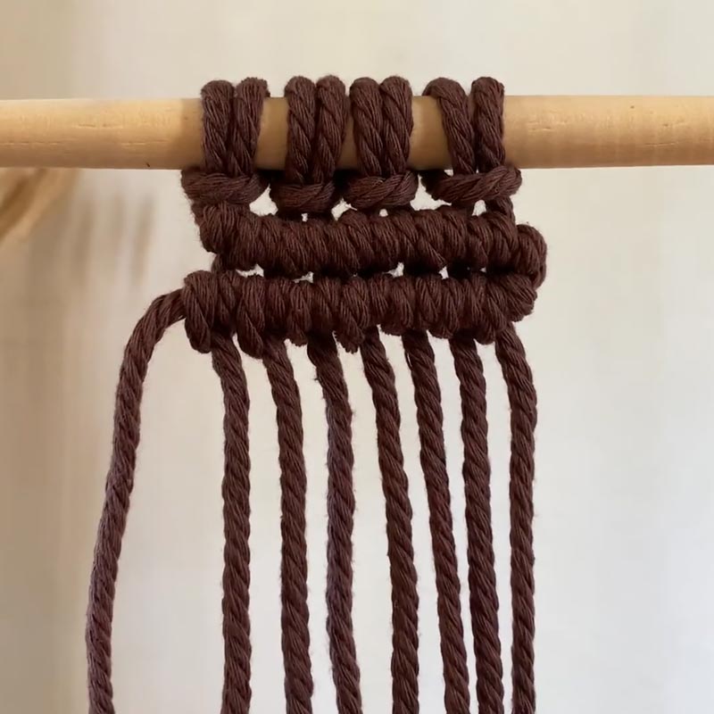 A Double Half-Hitch Knot, otherwise known as the Clove Hitch, is made by tying two half-hitch knots and working around a filler cord. This helps to create a straight line for your macrame project and can be made vertically, horizontally, and diagonally. For this tutorial, we will be showing you how to make it horizontally.