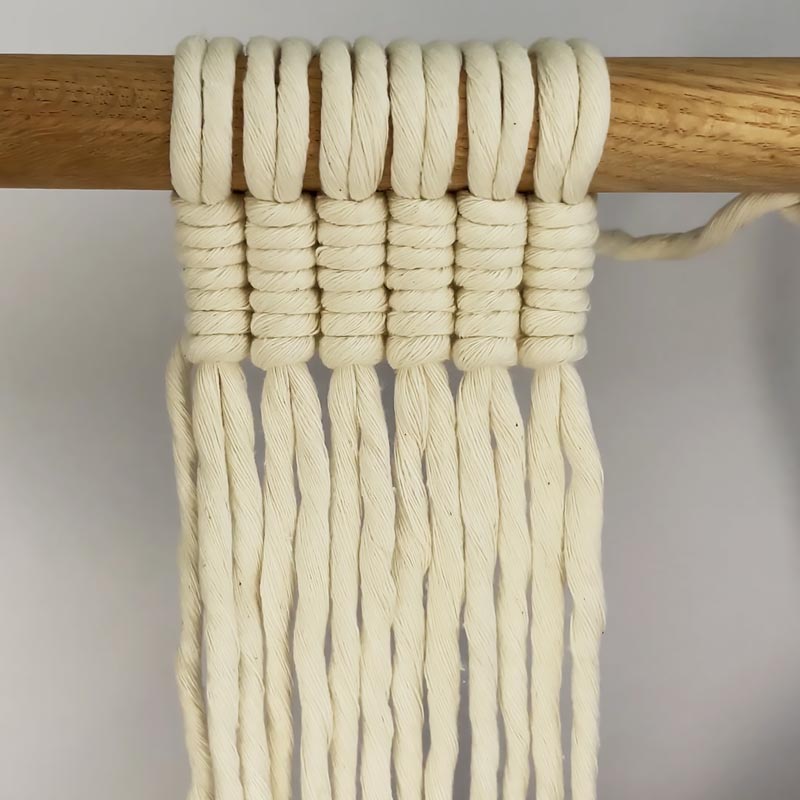 Here's the vertical method to make a Vertical Double Half Hitch Knot. This is the easiest method you can try; it works fast, too. 
