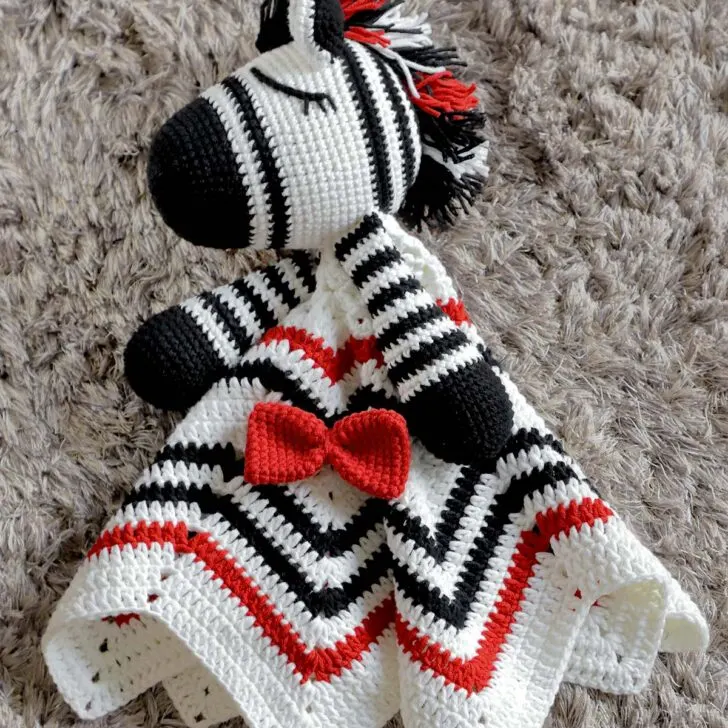 Learn how to make this simple, easy, and adorable Crochet Lovey Blanket. It's a wonderful baby shower gift for your little ones and expecting moms.