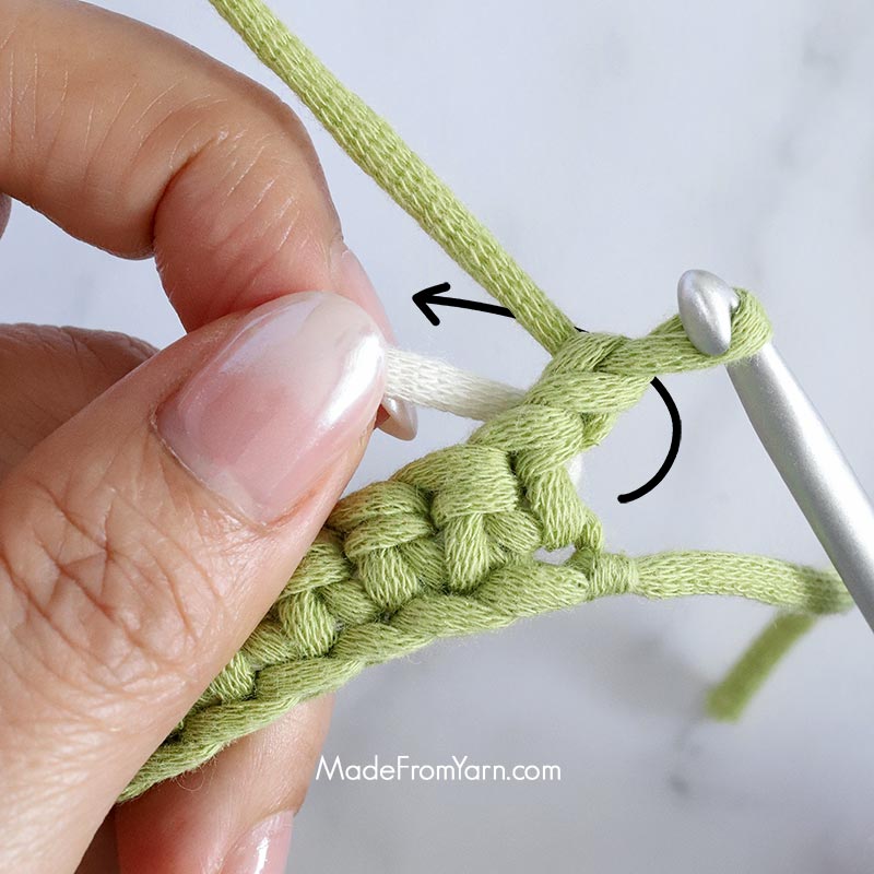 Always keep the unused yarn behind the work when you start a new row or new round. This technique keeps the unused yarn secure and hidden within your stitches, creating a clean look and adding structure to your crochet piece.