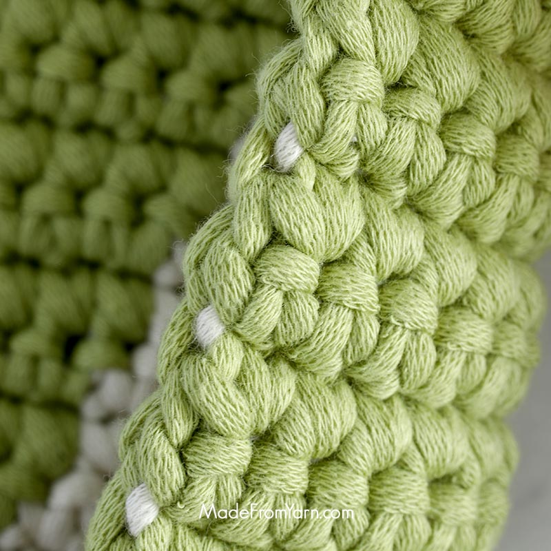 Always keep the unused yarn behind the work when you start a new row or new round. This technique keeps the unused yarn secure and hidden within your stitches, creating a clean look and adding structure to your crochet piece.