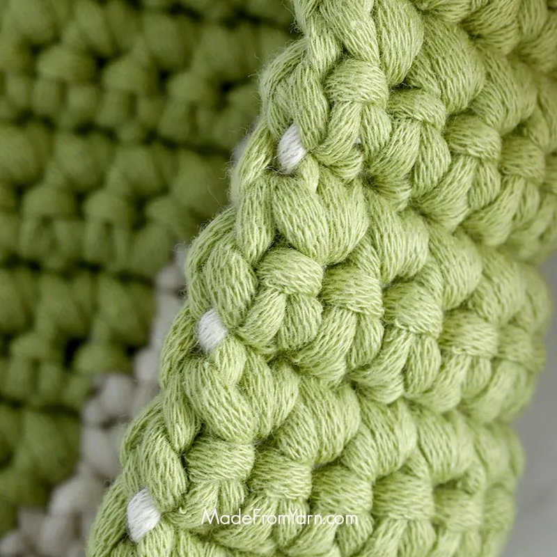 Always keep the unused yarn behind the work when you start a new row or new round. This technique keeps the unused yarn secure and hidden within your stitches, creating a clean look and adding structure to your crochet piece.